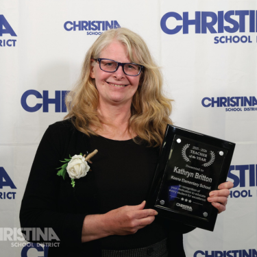Photo of Kathryn Britton Keene ES Teacher of the Year holding plaque